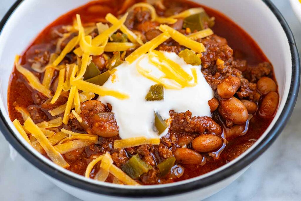 Chili topped with pumpkin and fresh cream