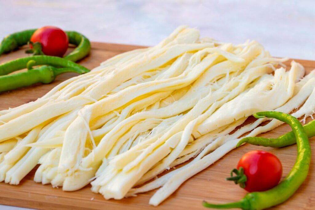 Chopped string cheese with greenchillies and tomatoes aside